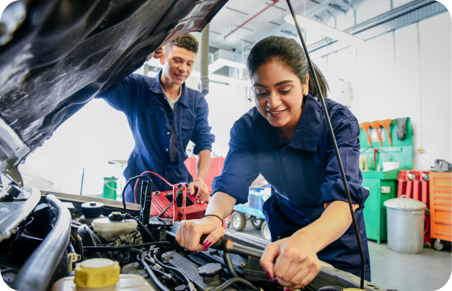 Female Automotive Student in an Engine Bay