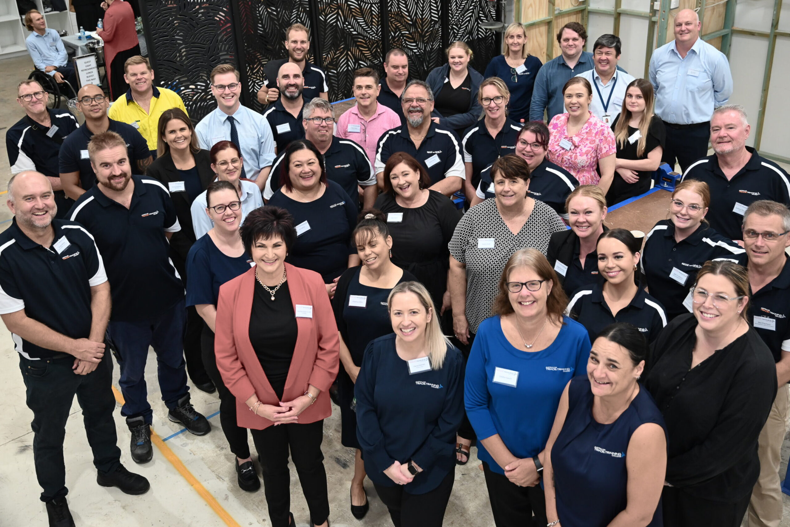 Australian Trade Training College staff team posing together indoors
