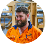 Smiling Southern Downs Regional Council employee in hi-vis shirt